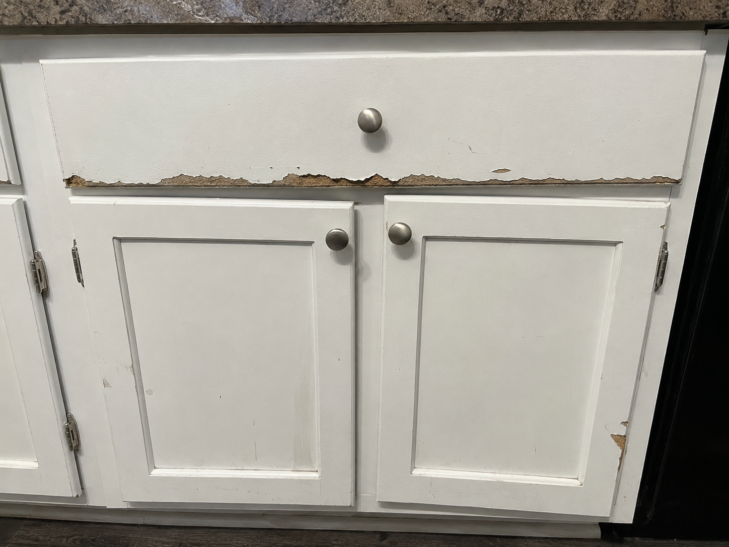 Cabinet damage before repair